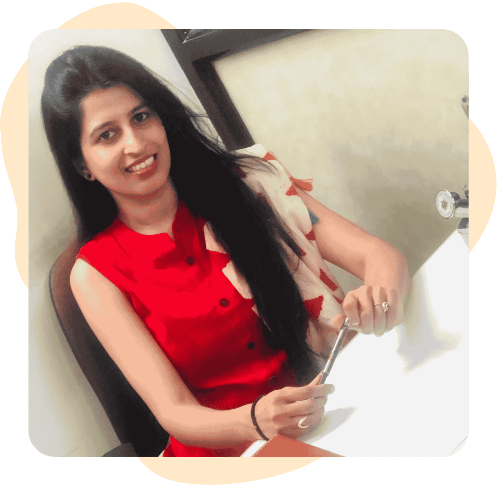 A smiling Pic of Dr. Amulya Shetty with long black hair