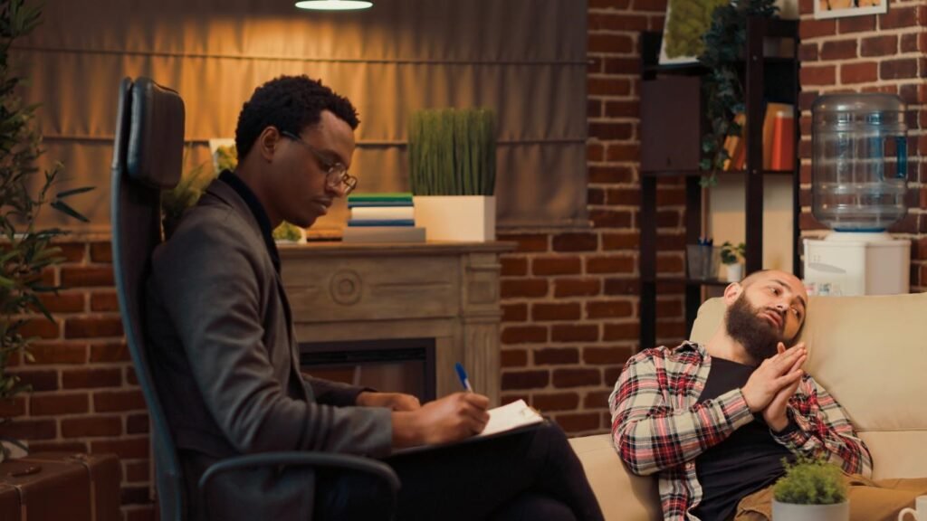 Therapist counselling a man during a session to improve focus, motivation, and emotional balance